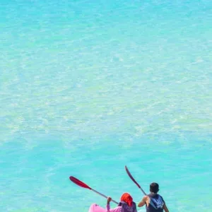 Two-person kayak ready for rental on Waikiki beach