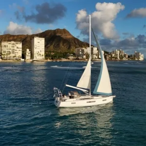 Luxury sailboat cruising past Diamond Head in Waikiki