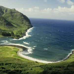 Sailboat navigating between Oahu, Lanai, and Molokai