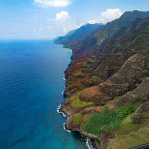 Sailboat cruising between Oahu and Kauai islands