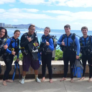 Students learning scuba skills in swimming pool