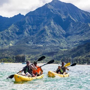 Tandem kayak floating on calm river near falls