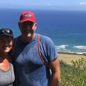 Hiker walking along Oahu's North Shore coastline