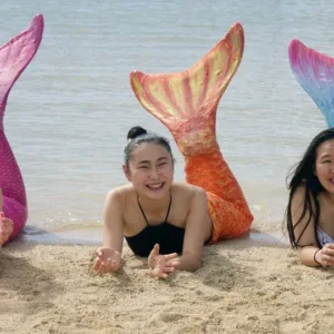 Group learning to use mermaid tails in shallow water