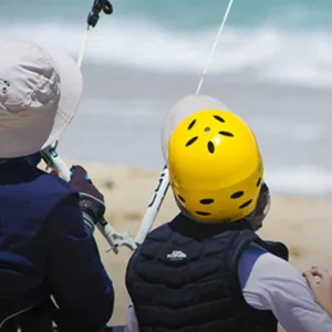 One-on-one kiteboarding coaching session on beach