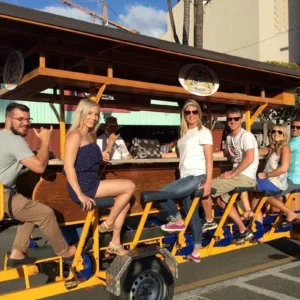 Fifteen passenger bike cruising through Honolulu streets