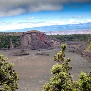 Hikers walking near volcanic crater rim