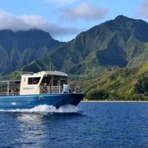 Snorkelers exploring sea caves along the Nā Pali Coast
