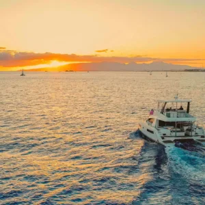 Sunset cruise boat sailing near Waikiki shore