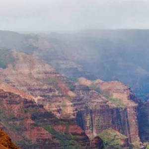 Wide view of Waimea Canyon’s red rock cliffs