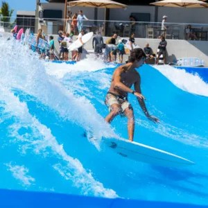 Surfer riding a massive 100-foot standing wave