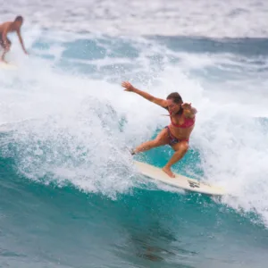Rochelle Ballard coaching surfer on Kauai beach