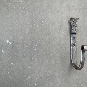 Blacksmith forging decorative dog head hook