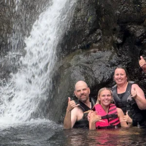 Tour group visiting waterfall and botanical garden