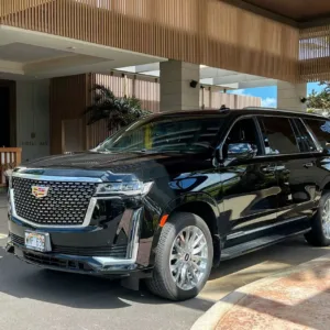 Luxury Escalade SUV ready for airport transfer