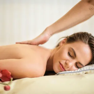Massage therapist performing Lomi Lomi massage