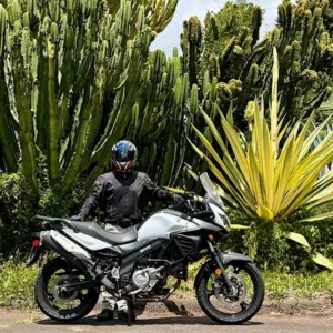 Suzuki V-Strom motorcycle parked on a dirt trail