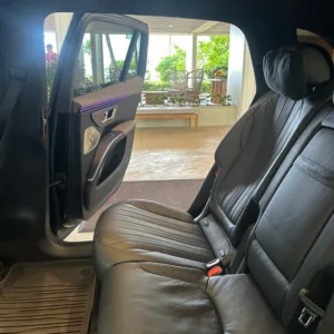 Luxury SUV parked at airport arrival area