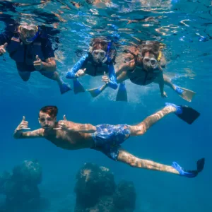 Snorkelers exploring coral reefs off Maui coast