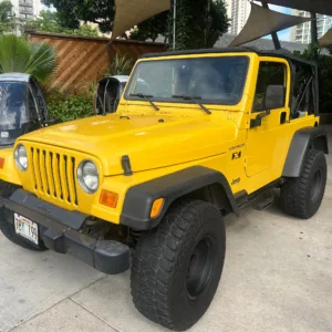 Yellow vintage Jeep ready for island exploration