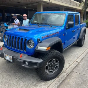 Open-air Gladiator Jeep parked on island street