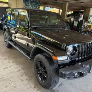 Black 2022 four-door Jeep with open-air style