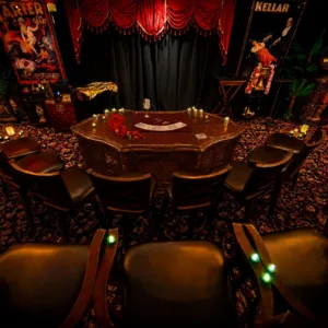 Magician performing close-up tricks in elegant London-style salon