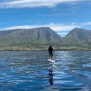 Participants trying electric hydrofoil boards during demos