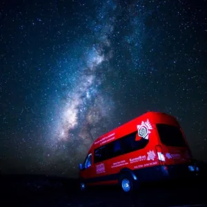 Night sky filled with stars over volcanic landscape