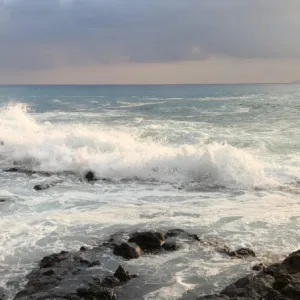 Traveler meditating on a mountain during a spiritual adventure tour