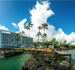 Kayaking near waterfalls and historic Hilo Bay views