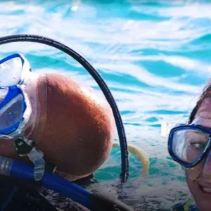 Diver practicing rescue techniques in open water