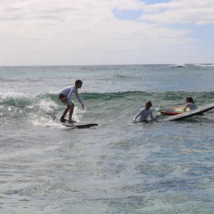 Semi-private surf lesson with instructor helping beginners
