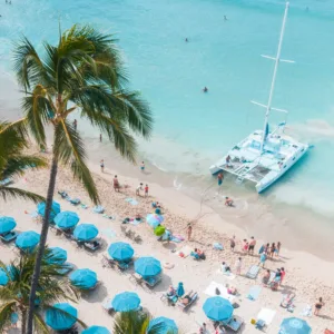 Catamaran sailing along Waikiki coastline during day tour