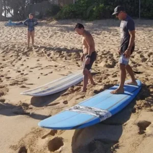 Learning to surf with a small group on island waves