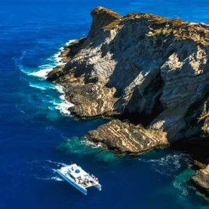Tourists snorkeling near Niihau and Napali coastline