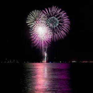 Sunset cruise boat with passengers enjoying BYOB experience