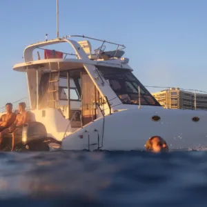 Couple enjoying a private sunset cruise on a catamaran