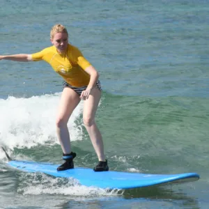 Personalized surfing lesson on gentle island waves