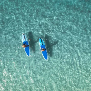 One-on-one stand up paddleboarding lesson on calm waters