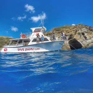 Private scuba diving charter exploring colorful underwater reefs