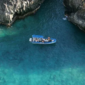 Snorkelers exploring sea caves along Kanaio coast