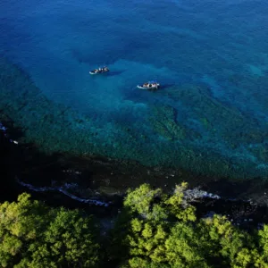 Snorkelers exploring sea caves along Kanaio Coast