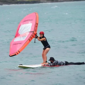 Windsurfer practicing skills during multi-day wing-surfing course