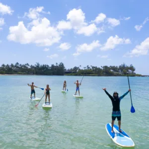 Group of paddlers navigating gentle waves together