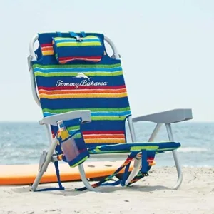 Comfortable beach chair set up on sandy shore