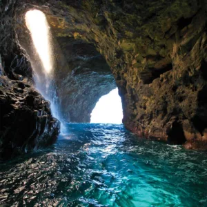 Raft expedition exploring sea caves on Napali Coast