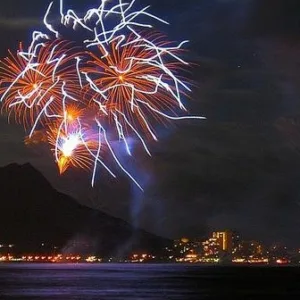 Fireworks display viewed from a festive evening cruise