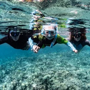 Boats exploring Kealakekua Bay’s scenic coastline near Capt. Cook