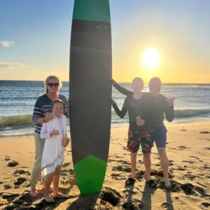 Group enjoying surf lessons on Maui beach